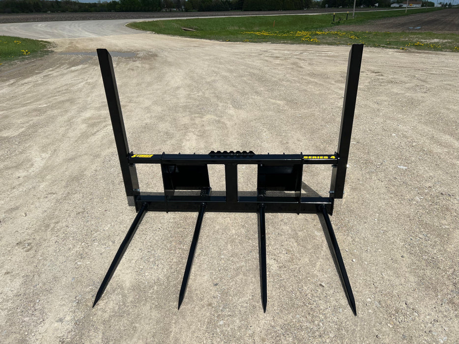 Heavy-duty bale spear by Stinger securely holding a large square bale – built for durability and dependable farm performance.
