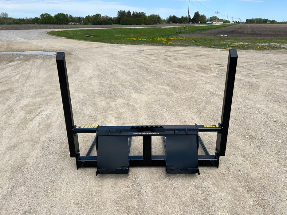 Durable bale spear by Stinger designed for moving and stacking hay bales – robust frame ideal for tractors and skid steers on agricultural operations.