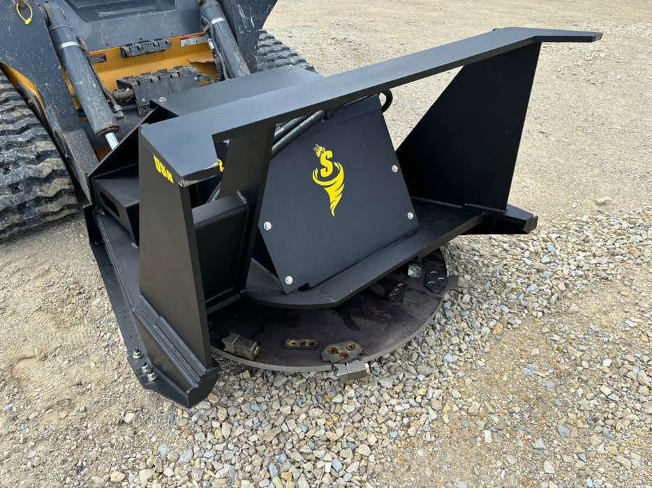 Powerful skid steer disc mulcher from Stinger Attachments reducing trees to mulch – heavy-duty construction ensures superior productivity.