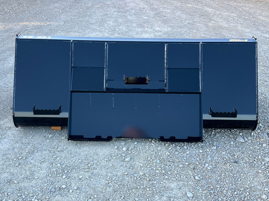 Skid steer manure bucket clearing barn floor – ideal attachment for farms, dairies, and livestock facilities.