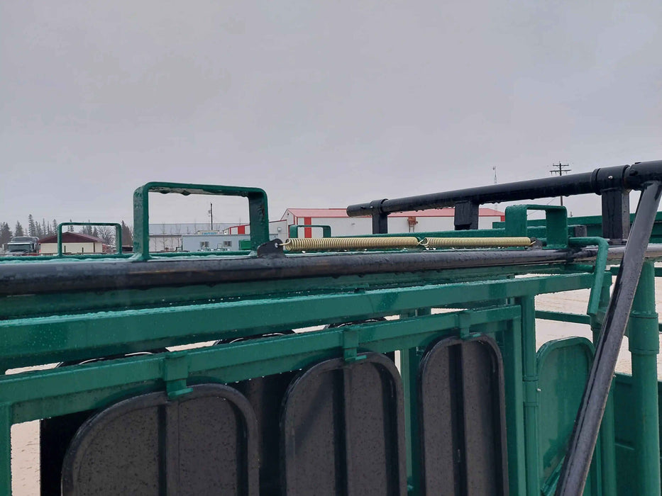 Ranch setup featuring Lakeland Cattle Squeeze Chute integrated with cattle alley system