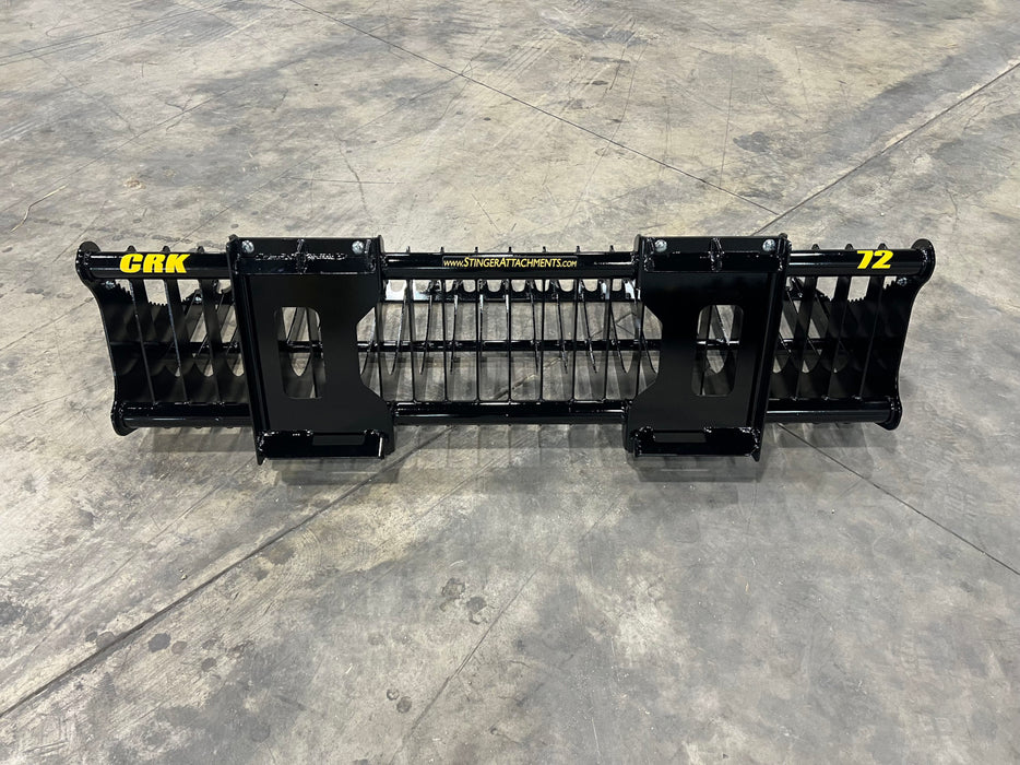 Compact rock bucket lifting stones and gravel – heavy-duty attachment designed for efficient rock sorting and land clearing.