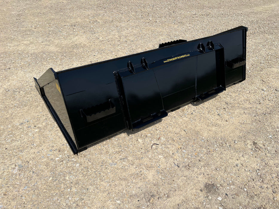 Durable Stinger skid steer material bucket transporting gravel – strong steel construction ideal for landscaping and construction tasks.