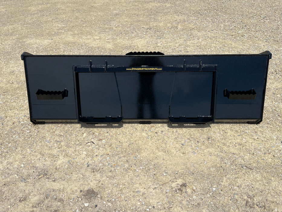 Stinger Series 3 skid steer material bucket attached to loader – professional-grade attachment for hauling, loading, and leveling materials.
