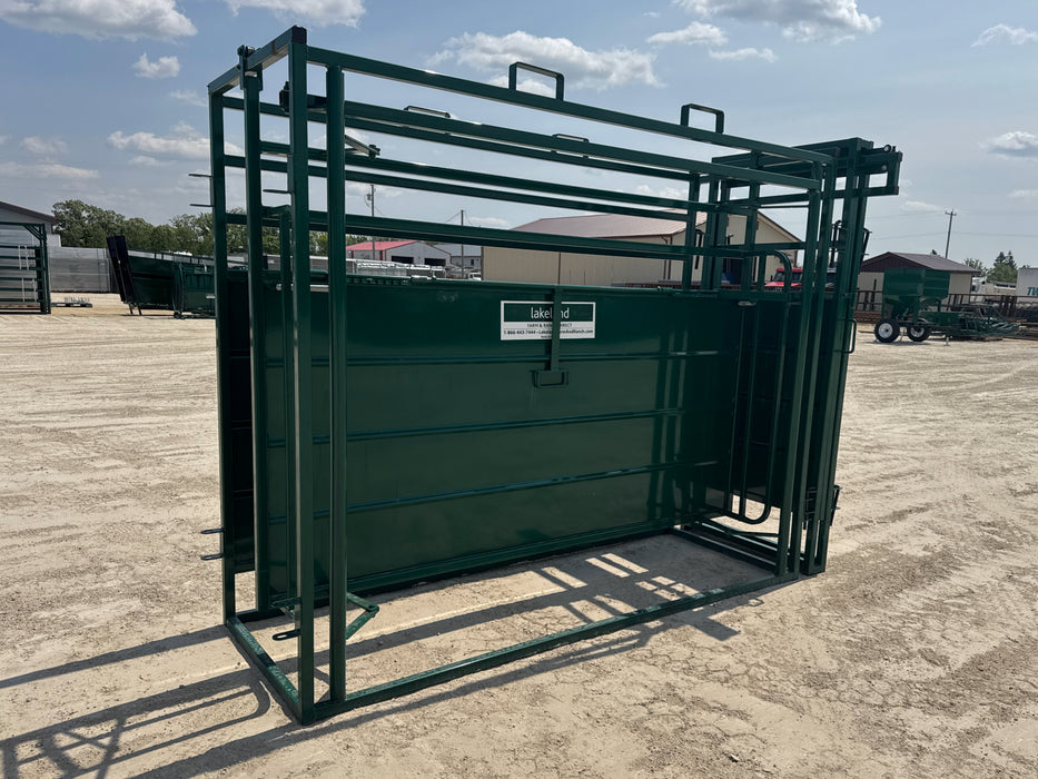 Farmer guiding cattle through Lakeland’s Adjustable Cattle Alley for stress-free handling