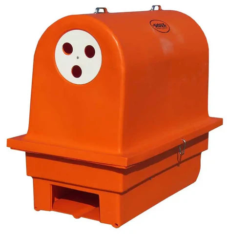 Newborn calf resting inside Sioux Steel Calf Warmer providing consistent warmth and improved survival rates.