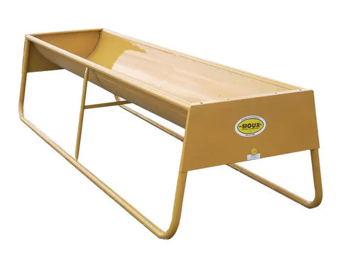 Cattle feeding from Sioux Steel Heavy-Duty Bunk Feeder designed to reduce waste and ensure easy access to feed.