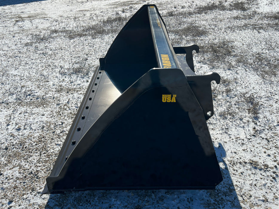 Heavy-duty skid steer bucket attached to loader lifting silage – rugged, high-performance attachment for agricultural and industrial use.