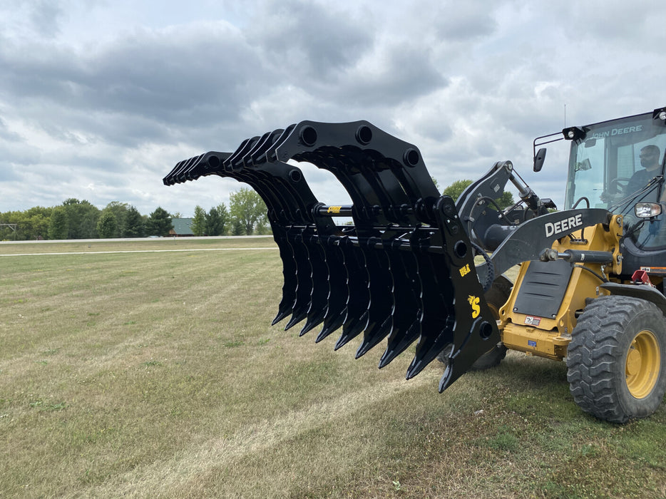 Close-up of the Stinger CG-XD tractor grapple bucket showing reinforced dual-arm clam design for maximum grip.