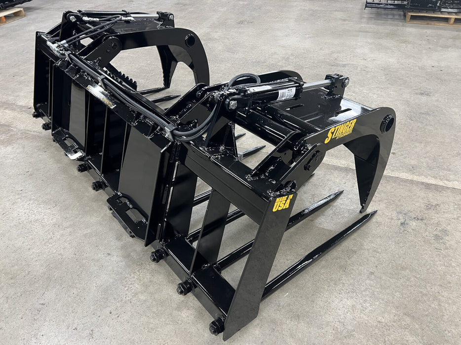 Stinger MG-Series skid steer manure grapple lifting compacted manure – professional-grade tool designed for strength and productivity.