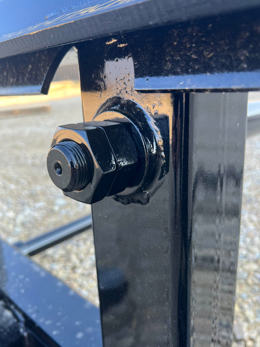 Standard-duty Stinger Attachments bale spear aligned with hay bale – precision design for easy penetration and secure lift.