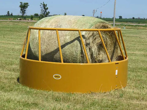 Close-up of Sioux Steel cattle hay feeder for round bales showing heavy-duty steel panels and rust-resistant coating.