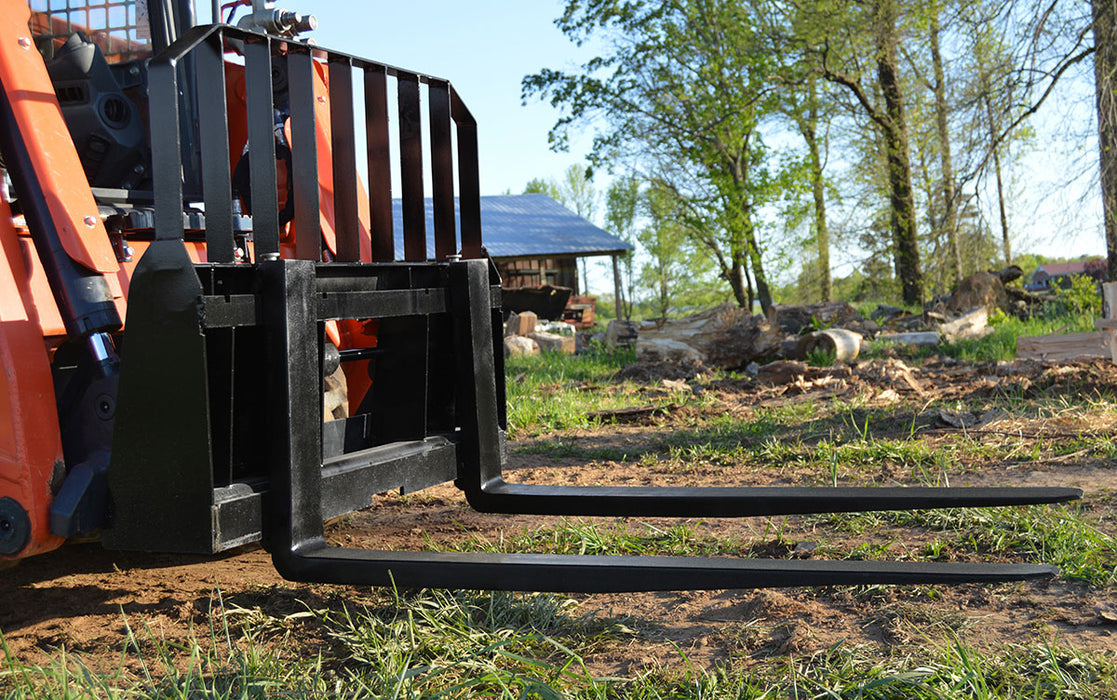 Loflin Skid Steer Pallet Forks with heavy-duty frame, perfect for lifting and moving pallets, logs, and materials on construction sites.