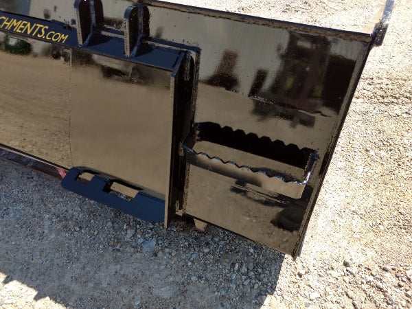 Heavy-duty skid steer material bucket by Stinger transferring dirt pile – designed for maximum productivity and reliability.