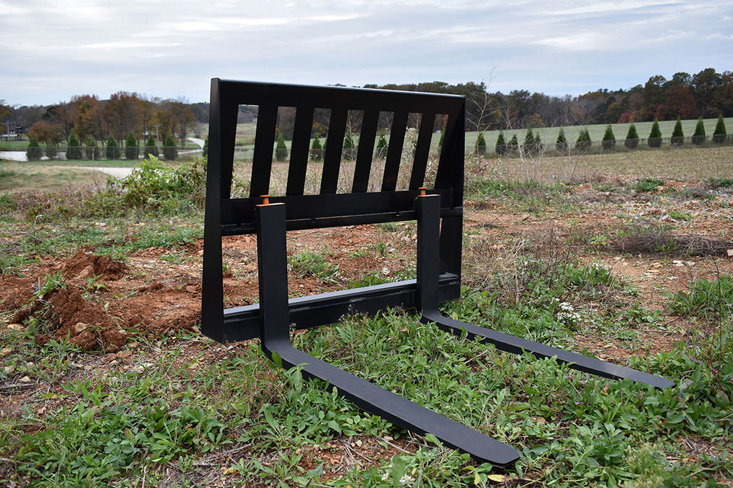 Loflin Tractor Pallet Forks with quick attach frame, designed for compact tractors to lift and move pallets, logs, and farm materials with ease.