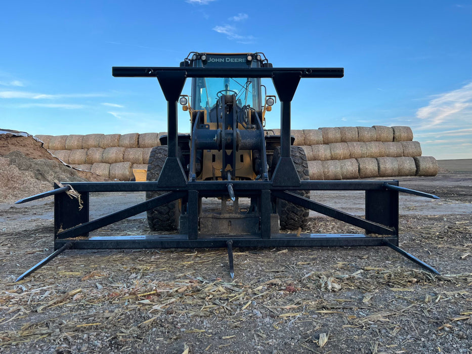 Heavy-duty tractor attachment Bale Spear 5XD demonstrating strength and precision on the farm.
