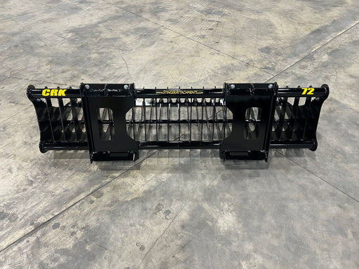 Compact rock bucket lifting stones and gravel – heavy-duty attachment designed for efficient rock sorting and land clearing.