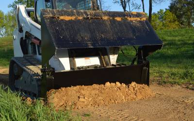 Heavy-Duty Skid Steer 4 in 1 Bucket by Loflin for Digging, Grading, and Grappling Tasks