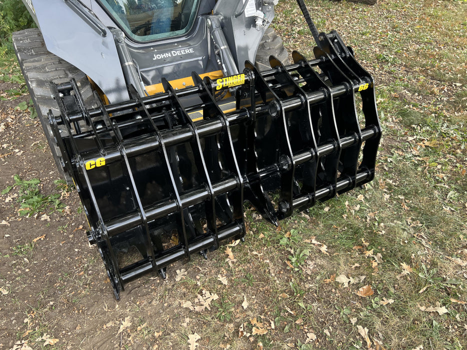 Side view of the Stinger Clam Grapple demonstrating its wide jaw opening and reinforced steel tines.