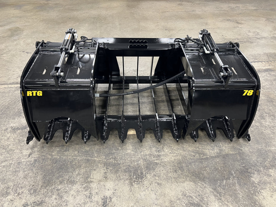 Front view of the tractor root grapple attachment showing extreme-duty build and precise grapple control.