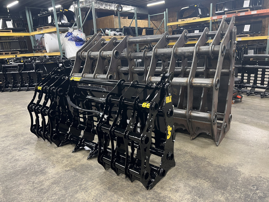 Tractor lifting tree trunks with the Stinger tractor grapple bucket, built for demanding farm and forestry work.