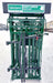 Operator using hydraulic head gate on Lakeland’s Easy Catch Cattle Squeeze Chute