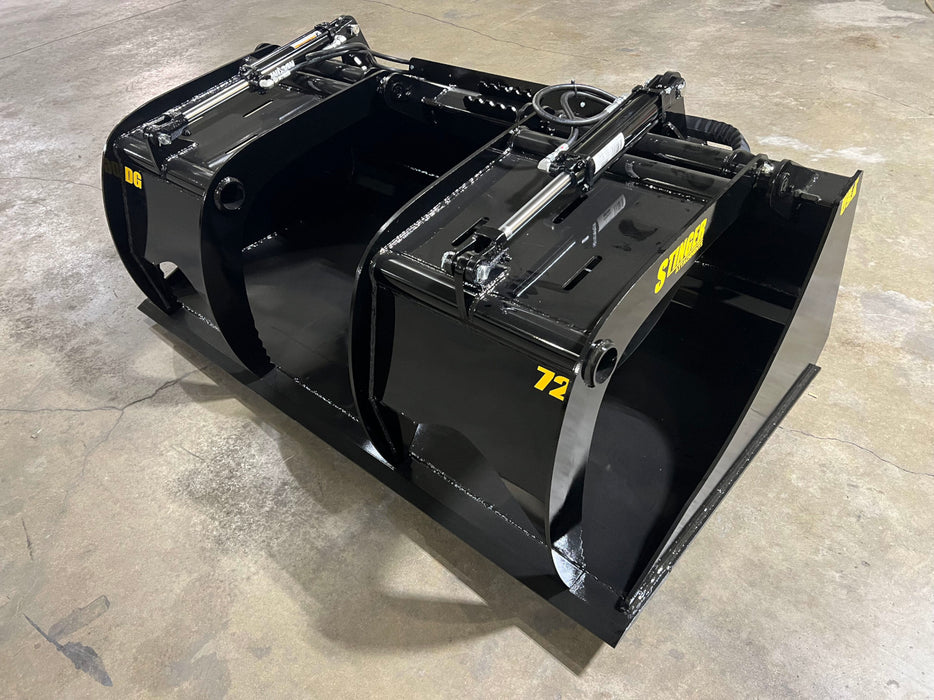 Heavy-duty demolition grapple bucket from Stinger DG Series mounted on a tractor lifting concrete debris on a job site.