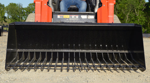 Heavy-duty manure bucket for skid steer with steel tines by Loflin, ideal for efficient barn clean-up and poultry waste removal.