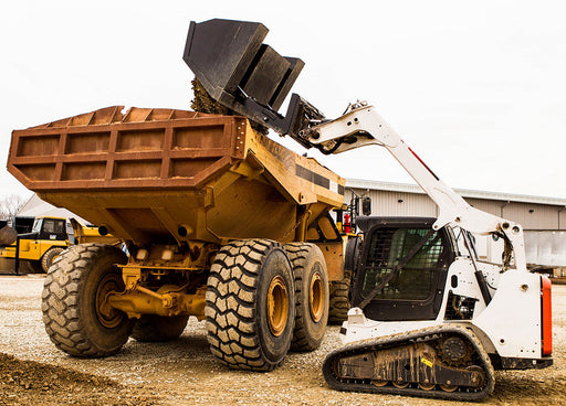Loflin Front Dump Bucket for skid steer loaders, designed for high dump clearance and efficient material loading and unloading.