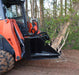 Loflin Fabrication skid steer tree puller gripping and removing small trees and brush – heavy-duty attachment built for land clearing and vegetation control.